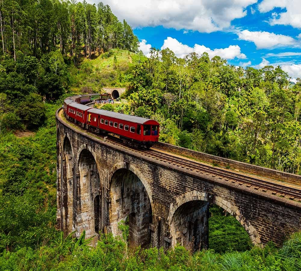 The Nine Arches Bridge in Ella with a train crossing, seen from the jungle viewpoint